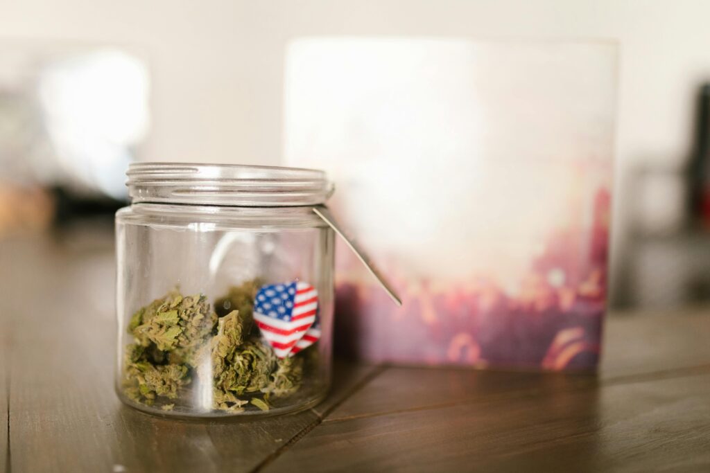 A jar of cannabis with an American Flag sticker