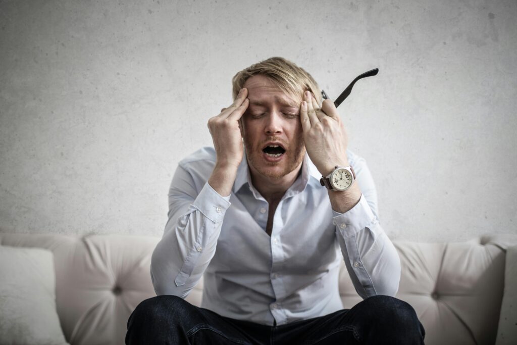 a perplexed person sitting on a couch