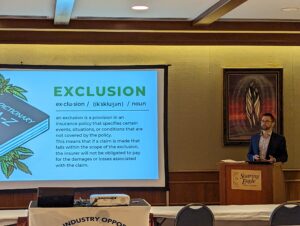 Tyler Bartosh giving a presentation about cannabis insurance exclusions